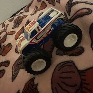 Miniature Monster Truck in Blue and White with Oversized Wheels